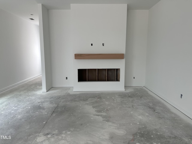 2874 Quarry Rd Unit 165, Rolesville, NC 27571 - unfurnished living room featuring unfinished concrete floors and a fireplace