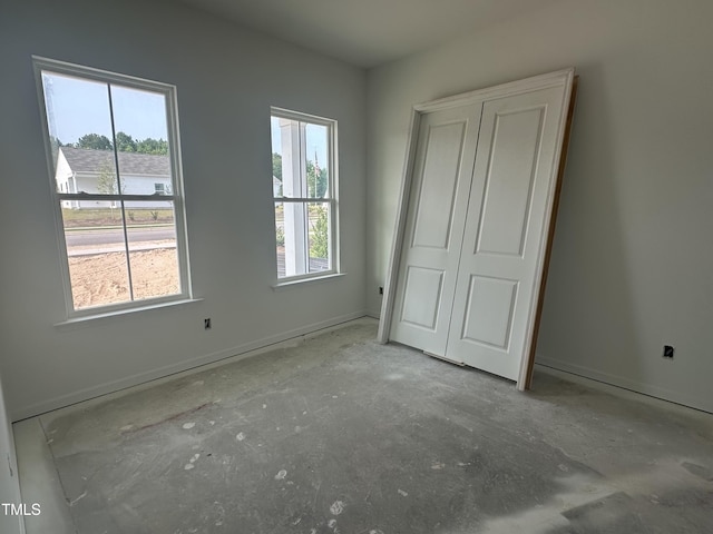 2874 Quarry Rd Unit 165, Rolesville, NC 27571 - unfurnished bedroom with multiple windows and a closet