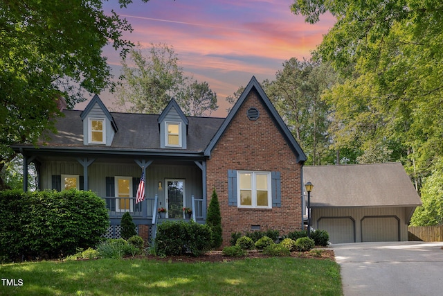 7901 Farnham Ct, Raleigh, NC 27615 - view of front facade with a front lawn, brick siding, a garage, covered porch, and driveway