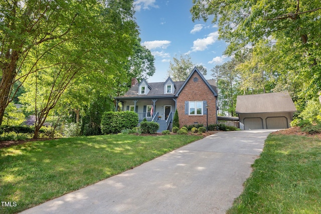 7901 Farnham Ct, Raleigh, NC 27615 - cape cod-style house with brick siding, a garage, a front yard, an outbuilding, and covered porch