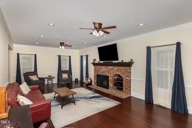7901 Farnham Ct, Raleigh, NC 27615 - living room with ceiling fan, a fireplace, recessed lighting, wood finished floors, and visible vents
