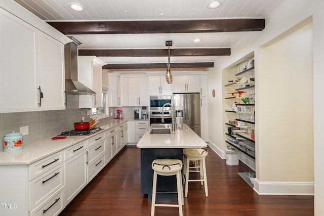 7901 Farnham Ct, Raleigh, NC 27615 - kitchen with wall chimney range hood, baseboards, appliances with stainless steel finishes, and white cabinets
