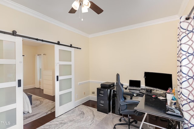 7901 Farnham Ct, Raleigh, NC 27615 - home office featuring a ceiling fan, crown molding, a barn door, wood finished floors, and baseboards
