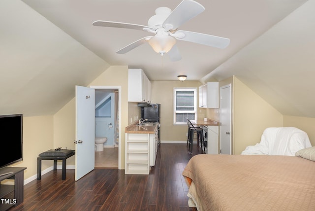 7901 Farnham Ct, Raleigh, NC 27615 - bedroom featuring dark wood-style flooring, baseboards, a ceiling fan, and lofted ceiling