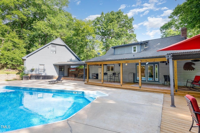 7901 Farnham Ct, Raleigh, NC 27615 - pool featuring a patio area, a wooden deck, and french doors