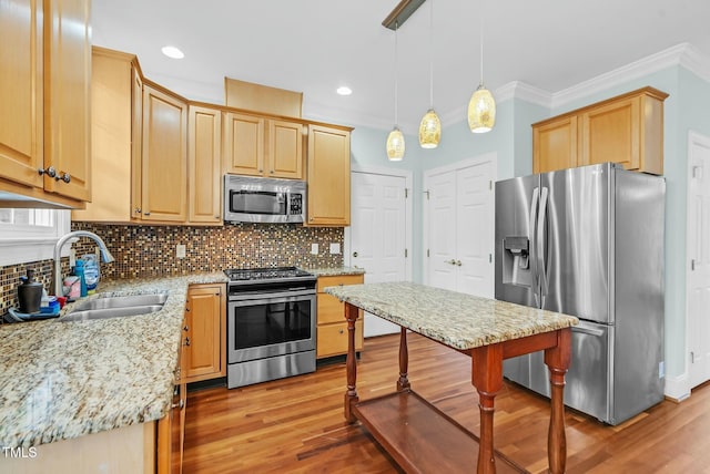 kitchen featuring light brown cabinets, stainless steel appliances, decorative backsplash, and a sink