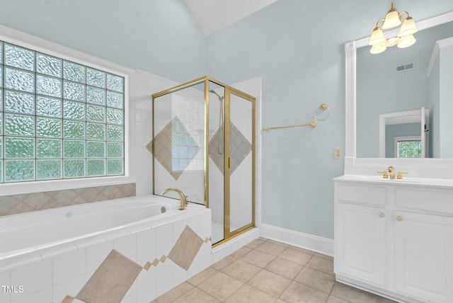 bathroom featuring a shower stall, a wealth of natural light, a bath, and vanity