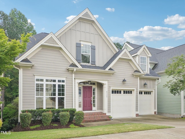 4125 Enfield Ridge Dr, Cary, NC 27519 - view of front facade featuring board and batten siding, concrete driveway, and an attached garage