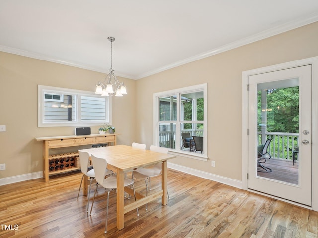 4125 Enfield Ridge Dr, Cary, NC 27519 - dining area with ornamental molding, a chandelier, light wood-style floors, and baseboards