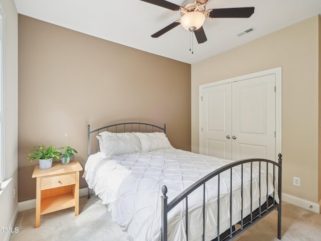 4125 Enfield Ridge Dr, Cary, NC 27519 - bedroom with carpet floors, a closet, baseboards, and a ceiling fan