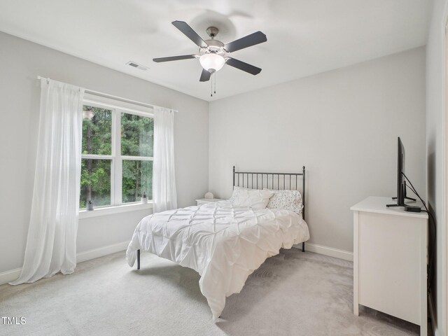 4125 Enfield Ridge Dr, Cary, NC 27519 - bedroom with light colored carpet, baseboards, and ceiling fan