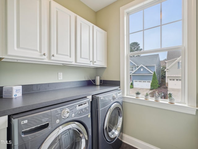 4125 Enfield Ridge Dr, Cary, NC 27519 - washroom with cabinet space, washer and clothes dryer, and baseboards