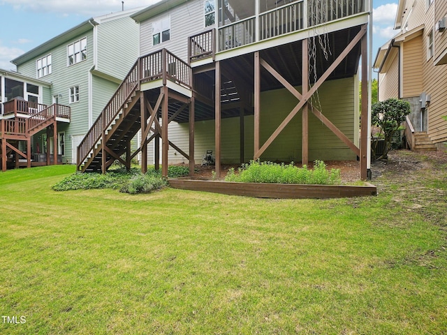 4125 Enfield Ridge Dr, Cary, NC 27519 - rear view of property featuring stairs, a yard, and a deck