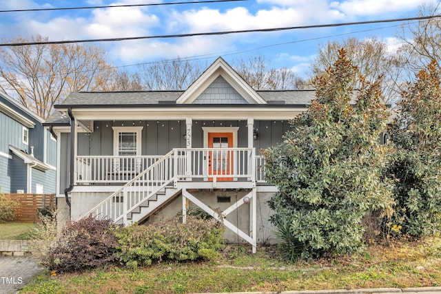 725 S State St, Raleigh, NC 27601 - bungalow-style home featuring board and batten siding, a shingled roof, fence, a porch, and stairs