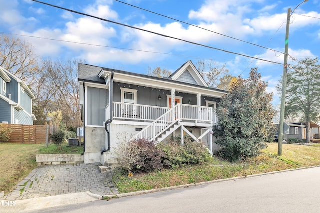725 S State St, Raleigh, NC 27601 - view of front of home featuring board and batten siding, a porch, stairs, and fence