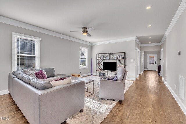 725 S State St, Raleigh, NC 27601 - living room featuring crown molding, light wood-type flooring, ceiling fan, baseboards, and recessed lighting
