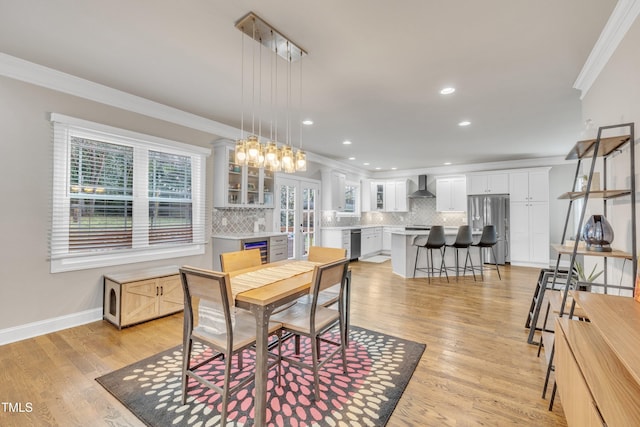 725 S State St, Raleigh, NC 27601 - dining area featuring recessed lighting, light wood-style floors, and crown molding