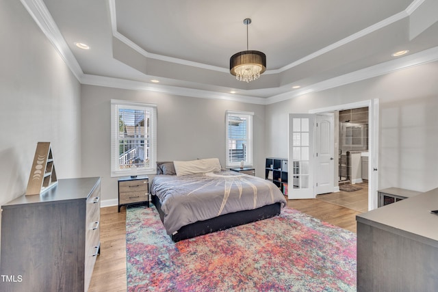 725 S State St, Raleigh, NC 27601 - bedroom with ornamental molding, a tray ceiling, multiple windows, and light wood-type flooring