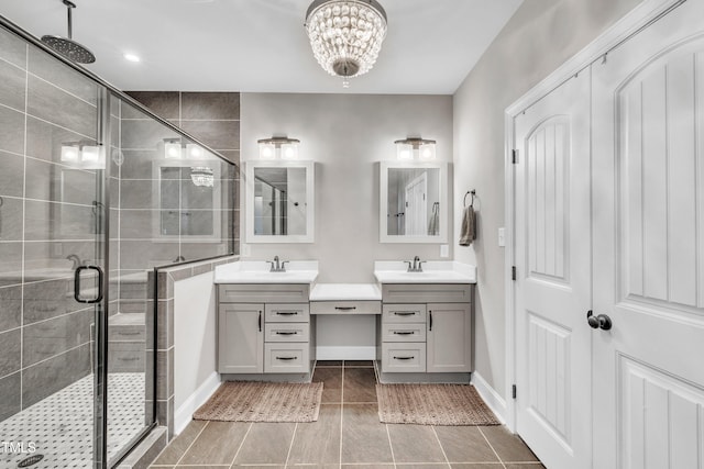 725 S State St, Raleigh, NC 27601 - bathroom with a shower stall, two vanities, a sink, and baseboards