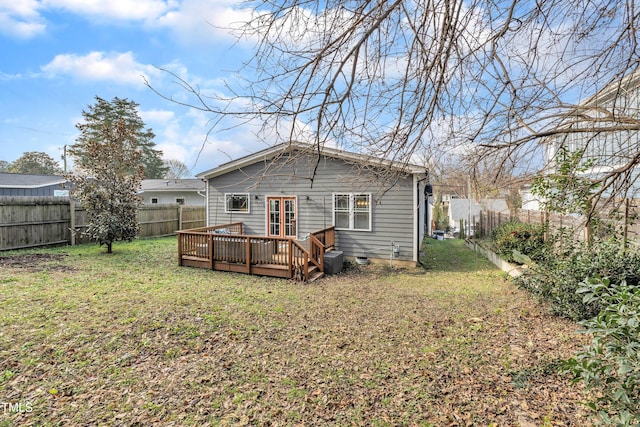 725 S State St, Raleigh, NC 27601 - back of house featuring a yard, a fenced backyard, and a deck