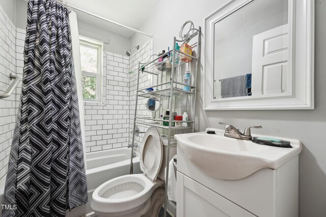 full bathroom featuring vanity, shower / bath combo, and toilet