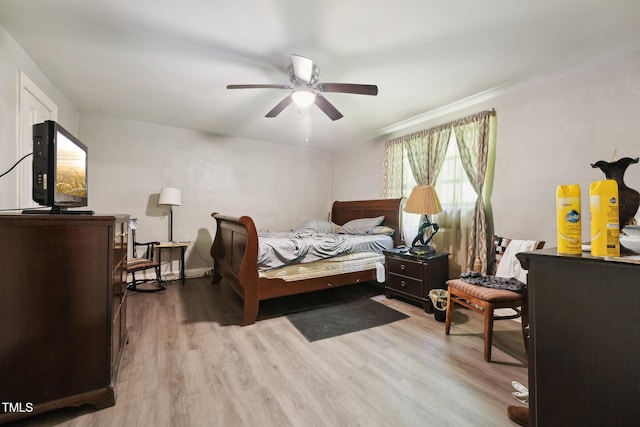 bedroom featuring wood finished floors and ceiling fan