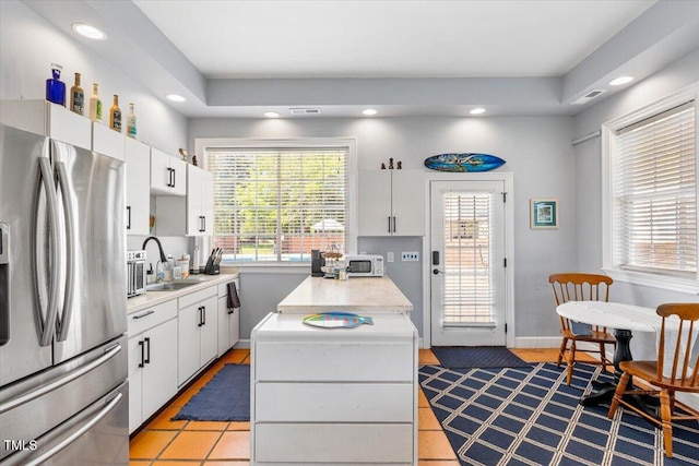 7348 NC-222 Hwy, Stantonsburg, NC 27883 - kitchen with a sink, stainless steel fridge, recessed lighting, white cabinetry, and light countertops