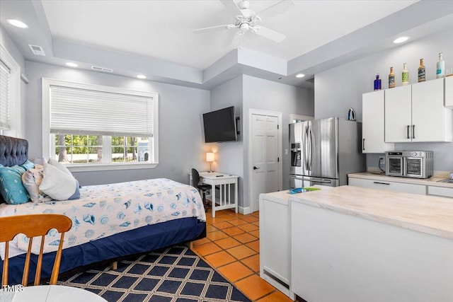 7348 NC-222 Hwy, Stantonsburg, NC 27883 - bedroom featuring stainless steel fridge, visible vents, a toaster, and light tile patterned floors