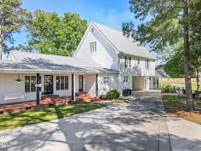 7348 NC-222 Hwy, Stantonsburg, NC 27883 - view of front of house with a porch, a standing seam roof, metal roof, and concrete driveway