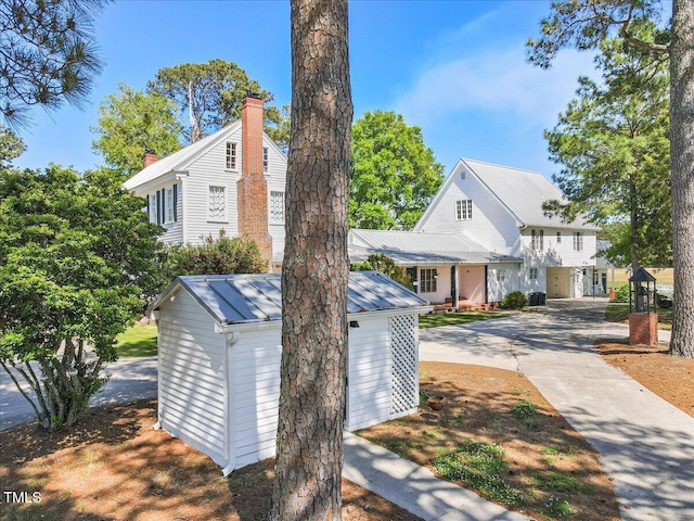 7348 NC-222 Hwy, Stantonsburg, NC 27883 - view of property exterior with concrete driveway and an outbuilding