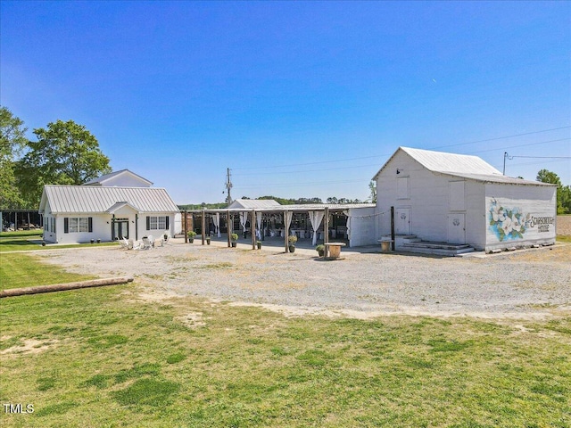 7348 NC-222 Hwy, Stantonsburg, NC 27883 - back of property with a yard and metal roof