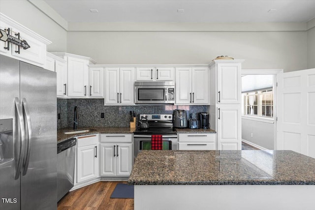 7348 NC-222 Hwy, Stantonsburg, NC 27883 - kitchen featuring white cabinetry, tasteful backsplash, appliances with stainless steel finishes, and a sink