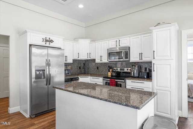 7348 NC-222 Hwy, Stantonsburg, NC 27883 - kitchen with white cabinetry, decorative backsplash, a sink, stainless steel appliances, and dark wood-style floors