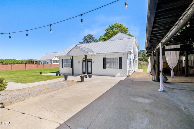 7348 NC-222 Hwy, Stantonsburg, NC 27883 - bungalow with metal roof, a front lawn, and fence