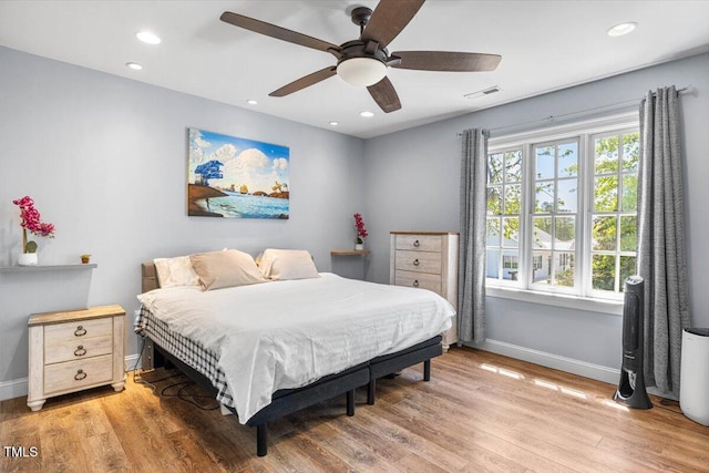 7348 NC-222 Hwy, Stantonsburg, NC 27883 - bedroom featuring recessed lighting, visible vents, light wood-style flooring, and baseboards