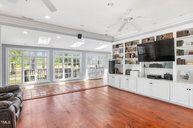 7348 NC-222 Hwy, Stantonsburg, NC 27883 - living area featuring recessed lighting, wood-type flooring, ceiling fan, visible vents, and ornamental molding