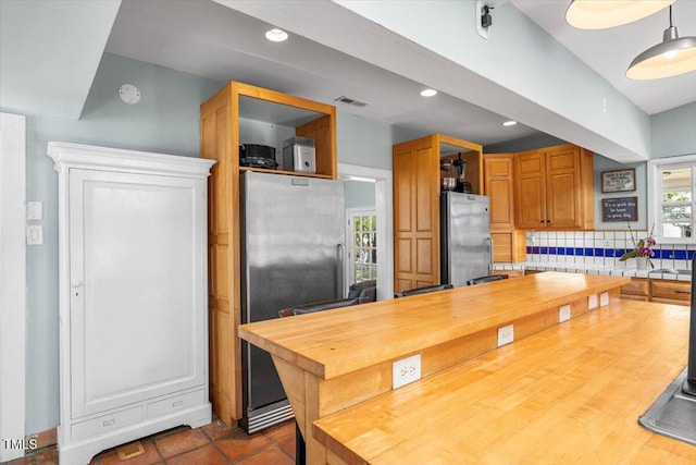 7348 NC-222 Hwy, Stantonsburg, NC 27883 - kitchen with visible vents, open shelves, backsplash, and freestanding refrigerator