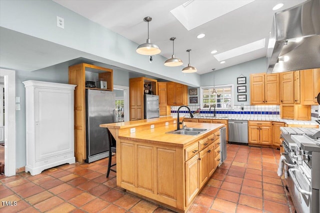 7348 NC-222 Hwy, Stantonsburg, NC 27883 - kitchen featuring range hood, a sink, stainless steel appliances, lofted ceiling with skylight, and backsplash