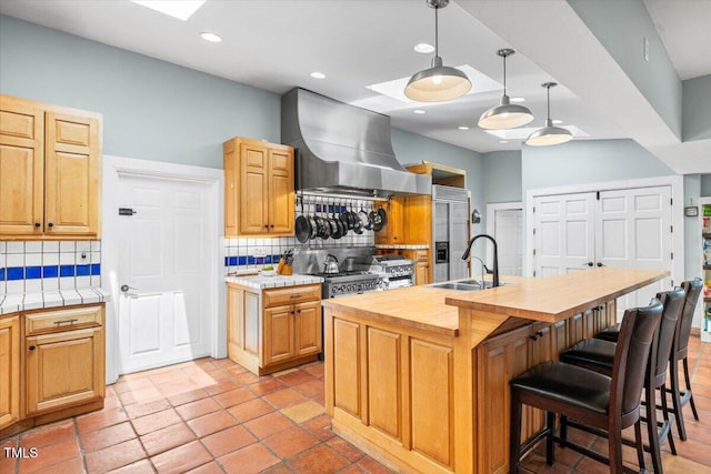 7348 NC-222 Hwy, Stantonsburg, NC 27883 - kitchen featuring ventilation hood, wood counters, decorative backsplash, and a sink