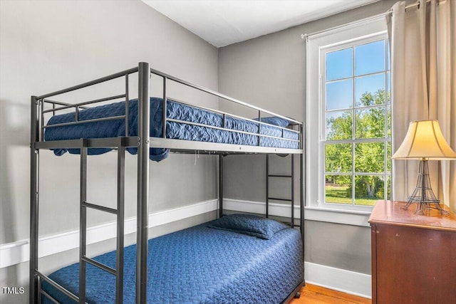 7348 NC-222 Hwy, Stantonsburg, NC 27883 - unfurnished bedroom featuring wood finished floors and baseboards