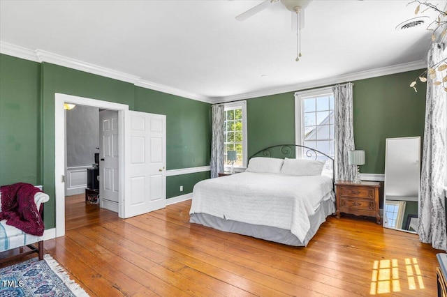 7348 NC-222 Hwy, Stantonsburg, NC 27883 - bedroom featuring visible vents, ceiling fan, ornamental molding, and wood-type flooring