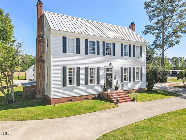 7348 NC-222 Hwy, Stantonsburg, NC 27883 - colonial inspired home with a chimney, metal roof, crawl space, and a front lawn