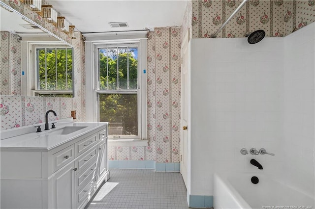 116 Hawthorne Rd, Raleigh, NC 27605 - bathroom with tile patterned flooring, vanity, shower / bathtub combination, wallpapered walls, and visible vents