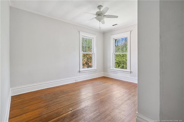 116 Hawthorne Rd, Raleigh, NC 27605 - unfurnished room featuring a ceiling fan, visible vents, crown molding, hardwood / wood-style flooring, and baseboards