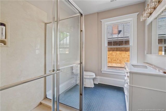 116 Hawthorne Rd, Raleigh, NC 27605 - full bath featuring an enclosed shower, tile patterned flooring, vanity, baseboards, and toilet