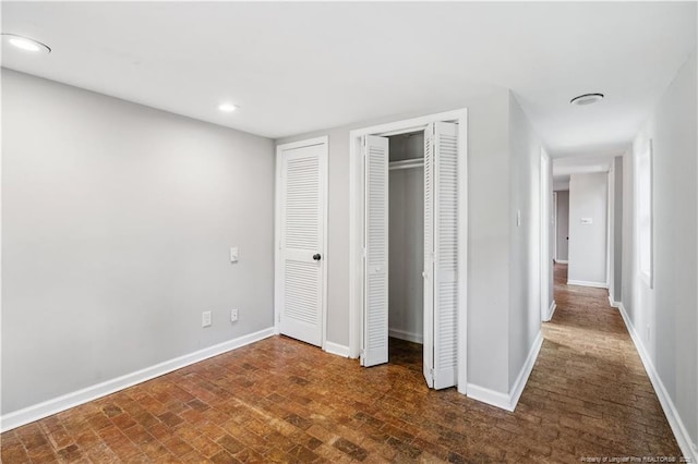 116 Hawthorne Rd, Raleigh, NC 27605 - unfurnished bedroom featuring recessed lighting, baseboards, and multiple closets