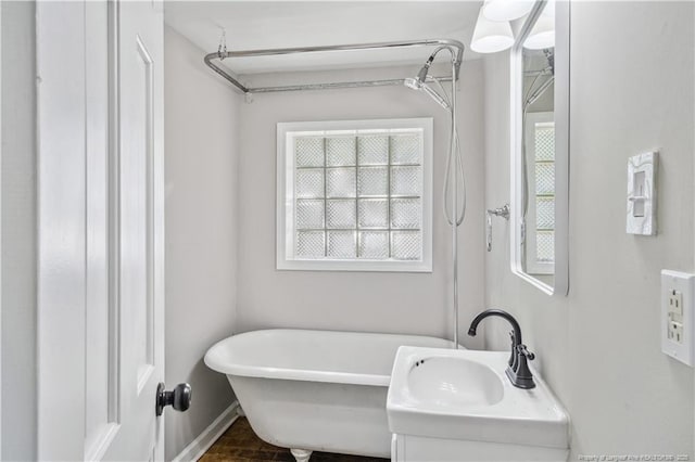 116 Hawthorne Rd, Raleigh, NC 27605 - full bath featuring a sink and a freestanding tub