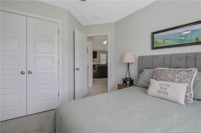carpeted bedroom with a closet