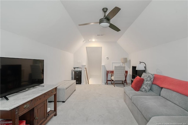 living area with lofted ceiling, visible vents, light carpet, and ceiling fan