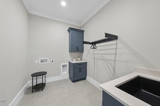 clothes washing area featuring hookup for an electric dryer, washer hookup, cabinet space, and baseboards